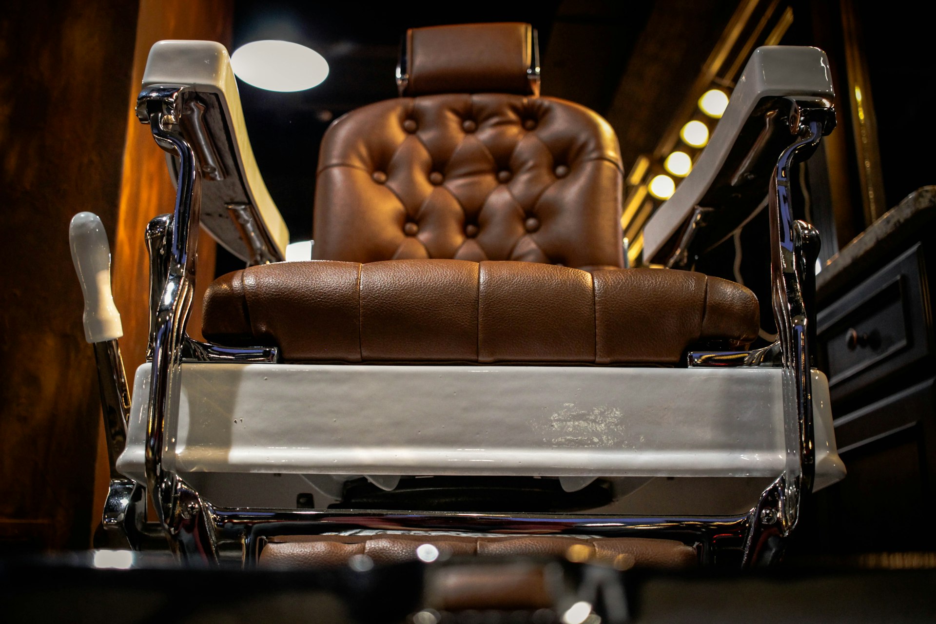 Vintage leather barber chair in low light